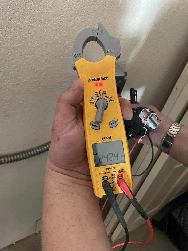 Voltage testing with clamp meter during Generator Installation in Sunny Isles Beach